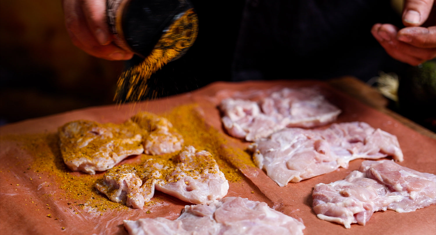 This image shows a seasoned chicken thighs