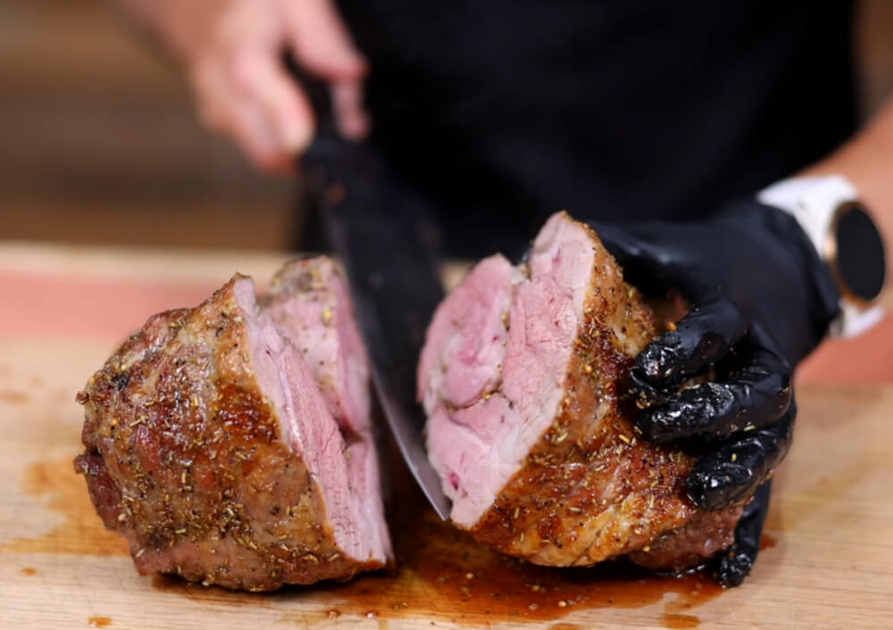 This_image_shows_cooked_lamb_shoulder_being_sliced