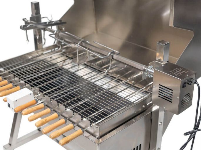Stainless steel hooded rotisserie and Cyprus grill with stainless steel skewers, wooden handles and electric rotisserie motor.