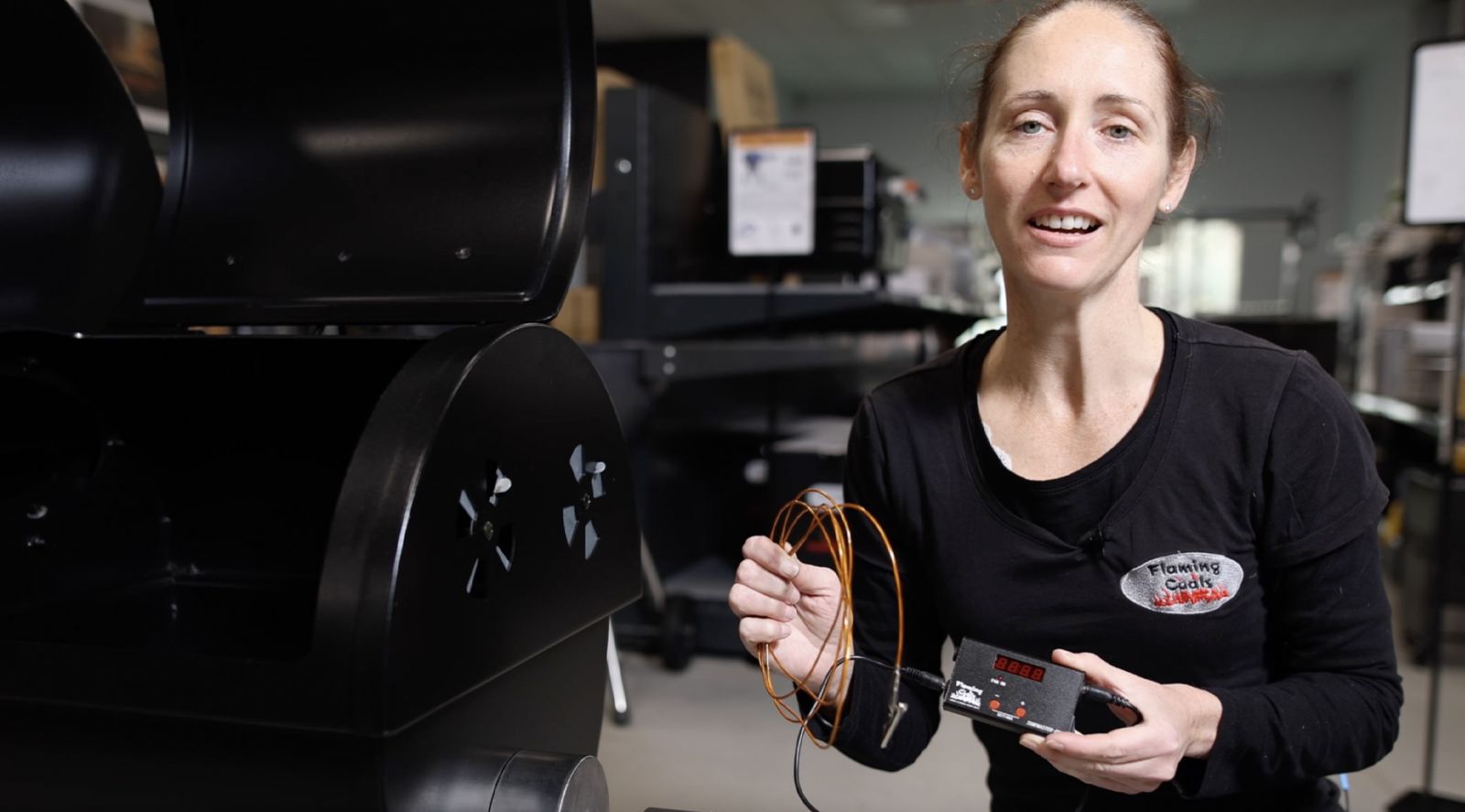 This image shows a woman holding the Tempmaster Pro