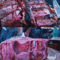 A GIANT PORTERHOUSE STEAK IS BEING GRILLED! image