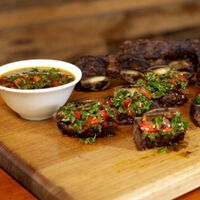 How to Cook Beef Short Ribs on an Argentine BBQ Grill (Plus Chimichurri That’ll Blow Your Socks Off) image